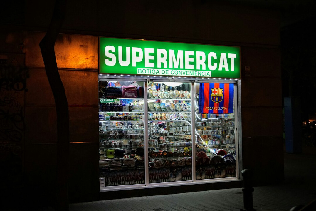 security guard patrolling supermarket at night