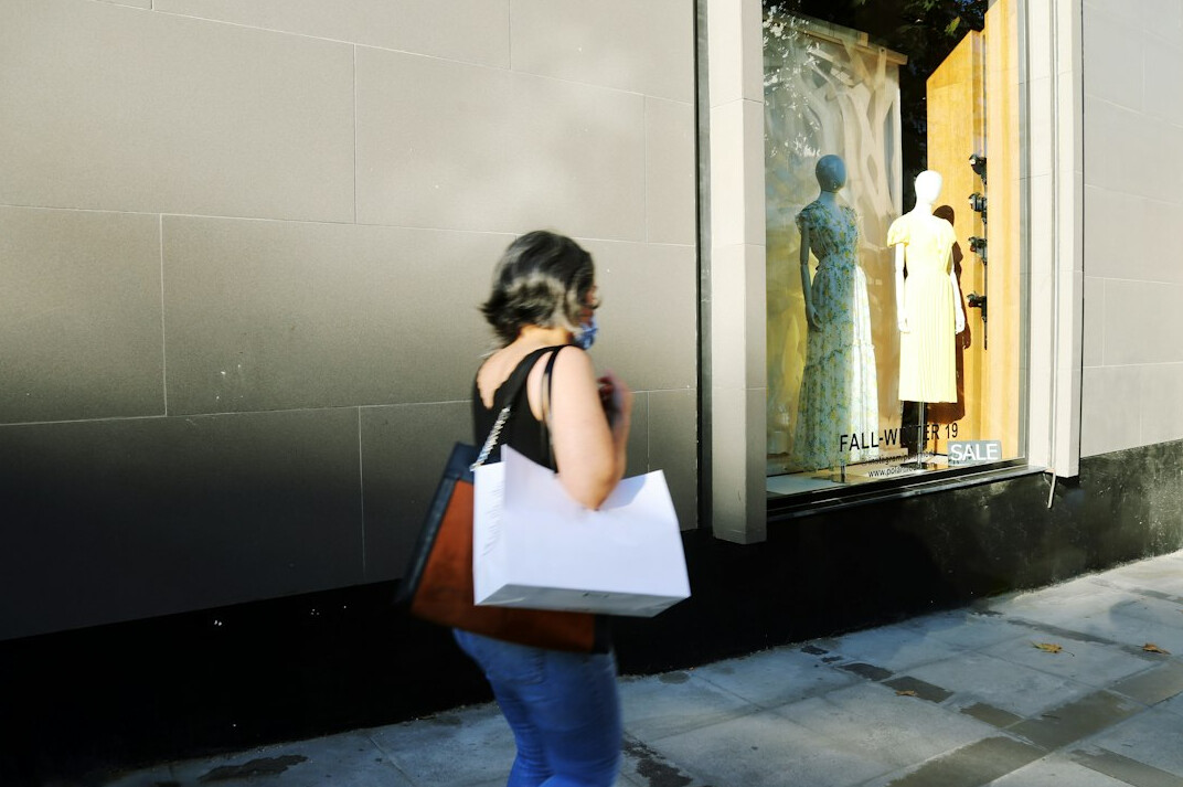 store detective watching shoppers
